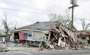Barber shop in New Orleans’ Ninth Ward heavily damaged by Hurricane Katrina in 2005, showing long-term hurricane destruction.