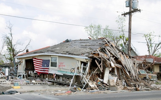 Barber shop in New Orleans’ Ninth Ward heavily damaged by Hurricane Katrina in 2005, showing long-term hurricane destruction.